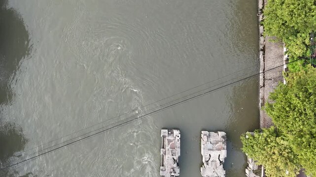 aerial view shows a river dam and water control management system
