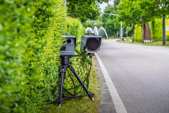 Mobile speed camera in a city. Police radar installed on roadside to control speed limit.