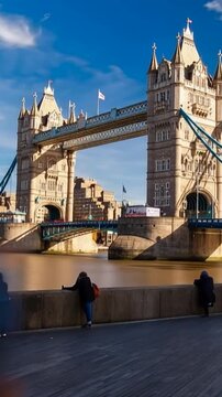 Tower Bridge in London, UK, United Kingdom. Time lapse. People walking. Vertical video
