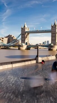 Tower Bridge in London, UK, United Kingdom. Time lapse. People walking. Vertical video