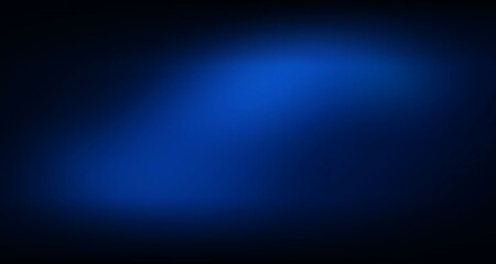 Obraz premium A blue gradient spot on a dark background with a glowing effect