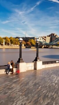 Tower Bridge in London, UK, United Kingdom. Time lapse. People walking. Vertical video