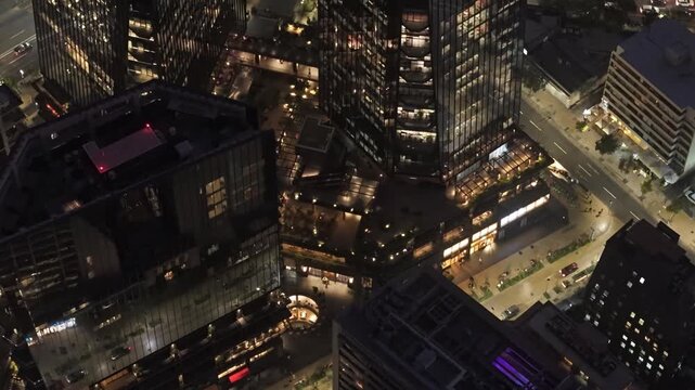 Night Aerial Flight over Mercado Urbano Tobalaba and Santiago Downtown Rooftops Chile