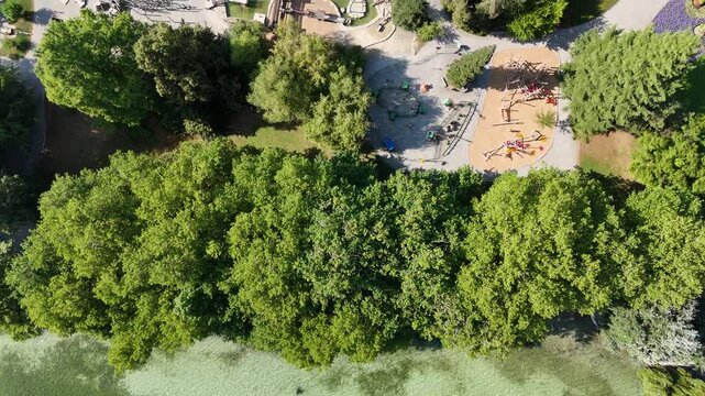 Top down flight over Lake Constance (Bodensee) and playground on island Mainau near Konstanz, Germany