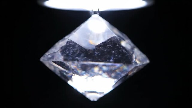 Geometric crystal refracting light, black background
