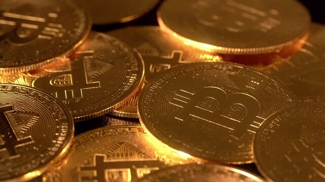 Close-up of a group of Bitcoin coins spinning in unison. Visual metaphor for growth, diversification and digital wealth. Warm tones and cinematic depth enhance premium financial storytelling.