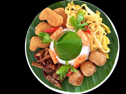 Traditional Indonesian Mini Nasi Tumpeng with Assorted Side Dishes