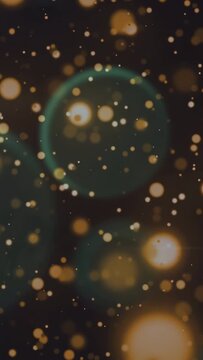 Vertical video: Pulse starting golden orbs drifting, specks growing, teal rings forming dense field