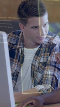 Vertical video: Lead dev watching monitor, junior dev typing and causing UI code revealing tech fix