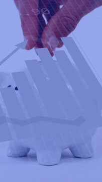 Vertical video: Hand entering with coin, dropping into piggy bank as analytics showing savings