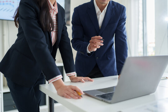 Business team collaborating on project in office meeting