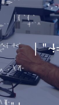 Vertical video: Man tapping phone and causing data symbols overlay while typing for business tasks