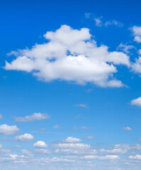 Obraz premium Sky with clouds closeup. Blue Sky background with tiny Clouds.