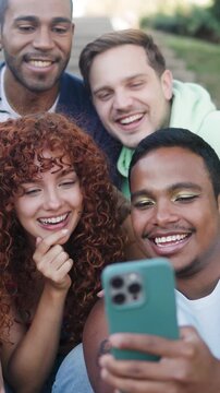 Young multiracial group of friends using mobile smartphone outside of college - Youth people life concept - vertical video