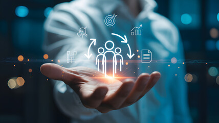 Fototapeta premium Human resources management concept with digital icons floating above an outstretched hand in soft focus lighting