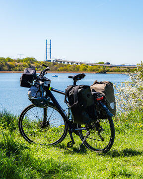 Touring Bicycle with Panniers in Foreground and R&uuml;gen Bridge over the Strelasund