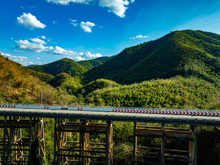 Fototapeta premium Huai Tong Bridge, officially known as Phor Khun Pha Muang Bridge, is Thailand tallest reinforced concrete bridge. Located in the misty mountains of Phetchabun province,