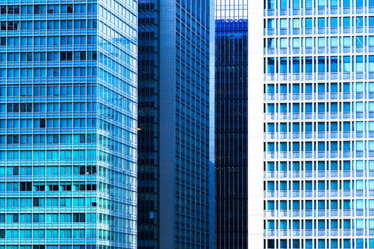 Abstract architectural layer effect of modern glass skyscrapers in Tokyo.