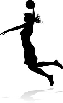 Silhouette of athletic woman female basketball player with basketball ball. Sports concept.