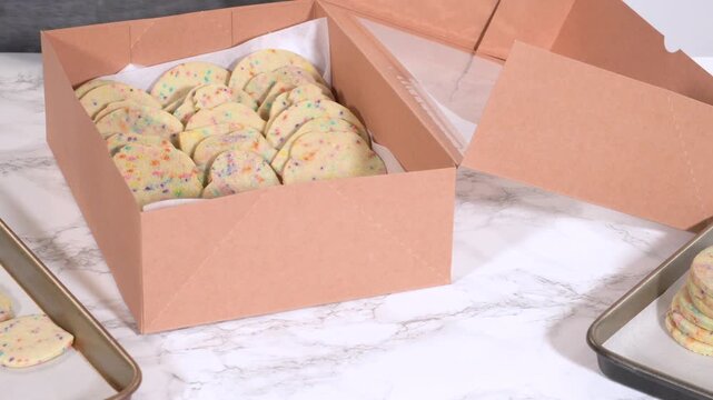 Packing Sprinkle-Adorned Sugar Cookies into Boxes