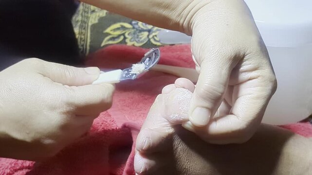 Pedicure treatment and toenail care close up.