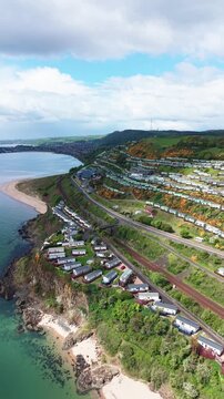 Aerial reverse view over the coastal caravan park at Pettycur Bay, Scotland.