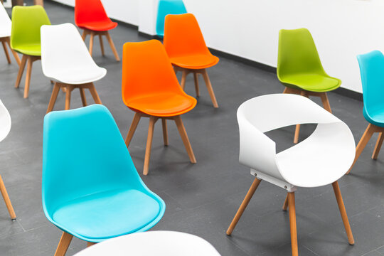 Empty chairs arranged at workshop