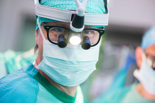 Portrait of heart surgeon with headlamp