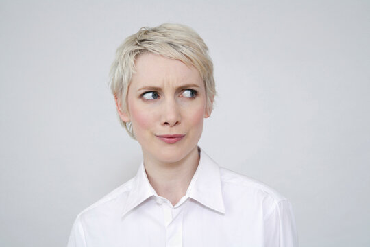 Young woman frowning, portrait
