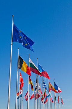 Luxembourg, European flags against sky