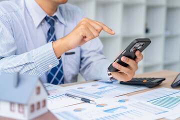 Fototapeta premium Business professional engaging in digital communication office setting smartphone usage collaborative environment close-up view productivity concept