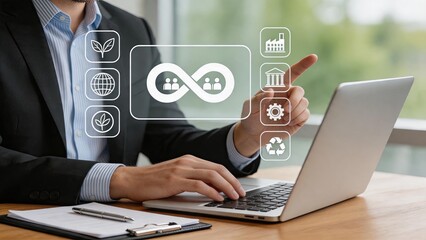 Fototapeta premium Businessman using laptop interacting with virtual hologram icons, sustainability, circular economy concept, green energy, recycling, ESG strategy and corporate responsibility.