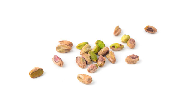 Fried salt pistachio nuts isolated. Baked pistachios pile, roasted green pistache fruits on white