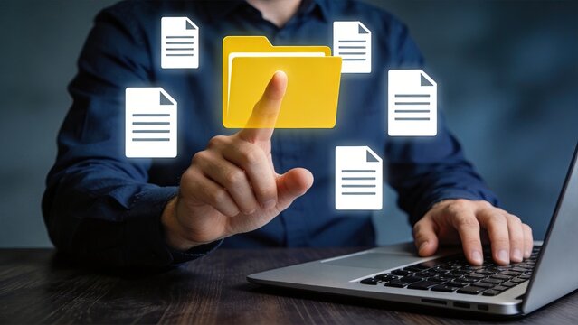 Businessman organizing digital files and folders, cloud storage concept, data management system interface, file organization, document handling on laptop computer, modern office