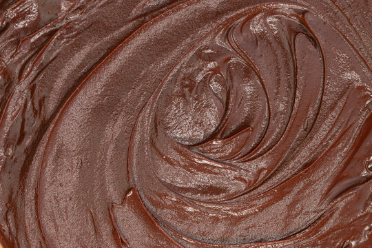Melted chocolate as background, closeup view.