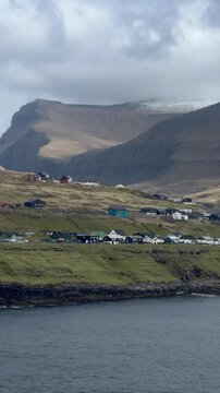 Eidi village on the isthmus of Eysturoy with the Atlantic Ocean and mountains, Faroe Islands