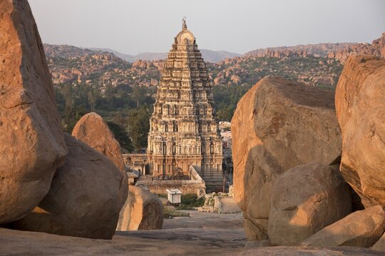 Granite rocks and Gopuram of the Virupaksha Temple, Hampi, Karnataka, India