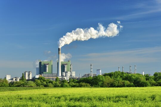 Steaming lignite-fired power plant in a green landscape, Schkopau power plant, Saxony-Anhalt, Germany