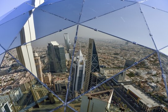 Reflection of the skyline in the glass sphere of Al Faisaliah Tower, Riyadh, Saudi Arabia