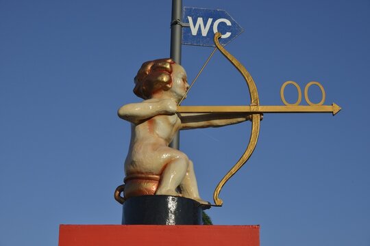 Archer Cupid as a toilet sign, Oktoberfest, Munich, Upper Bavaria, Bavaria, Germany