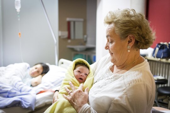 Grandmother with newborn in hospital, family, Bavaria, Germany
