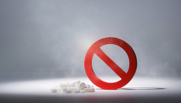 International Day Against Drug Abuse and Illicit Trafficking red prohibition symbol and scattered pills warn against substance misuse