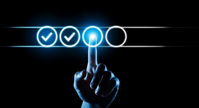 Hand touching glowing blue checkmark selection on dark background finger pressing