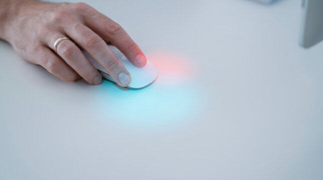 Hand using white computer mouse on desk with glowing light effect symbolizing ai cybersecurity strategy for digital protection and innovation