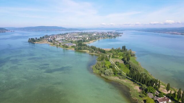 High rising hyperlapse over Reichenau peninsula and lake