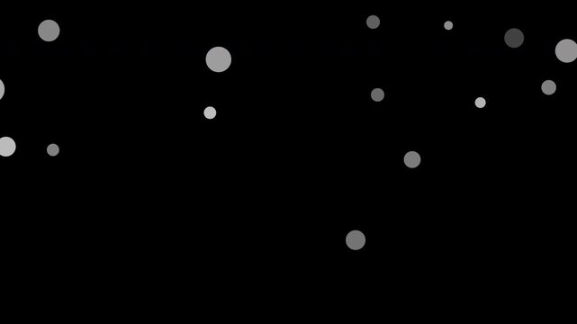 Dynamic white bokeh particles floating across dark space