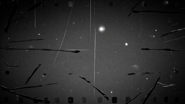 Old film overlay with scratches, dust, grain and frame borders, representing vintage cinema, retro texture, archival footage, analog nostalgia and classic aesthetic