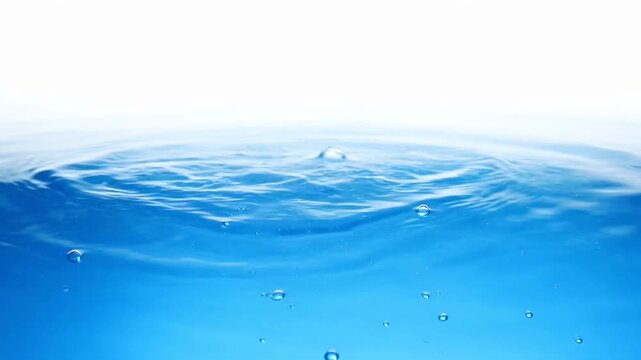 Clear water surface with rhythmic ripples and rising bubbles against a white background, representing purity, freshness, tranquility, clarity, and fluid movement