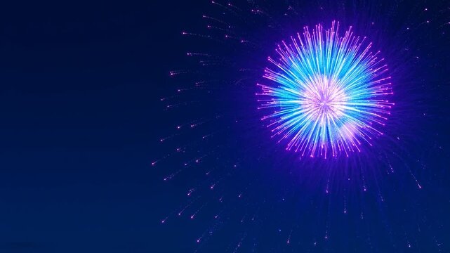 Bright blue and purple firework exploding against a dark night sky, representing celebration, victory, joy, festivity, accomplishment, display, and holiday spirit