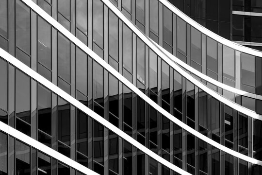 monochrome architecture turns diagonal lines into an abstract building facade, where windows, reflection and pattern cut across a dark exterior grid